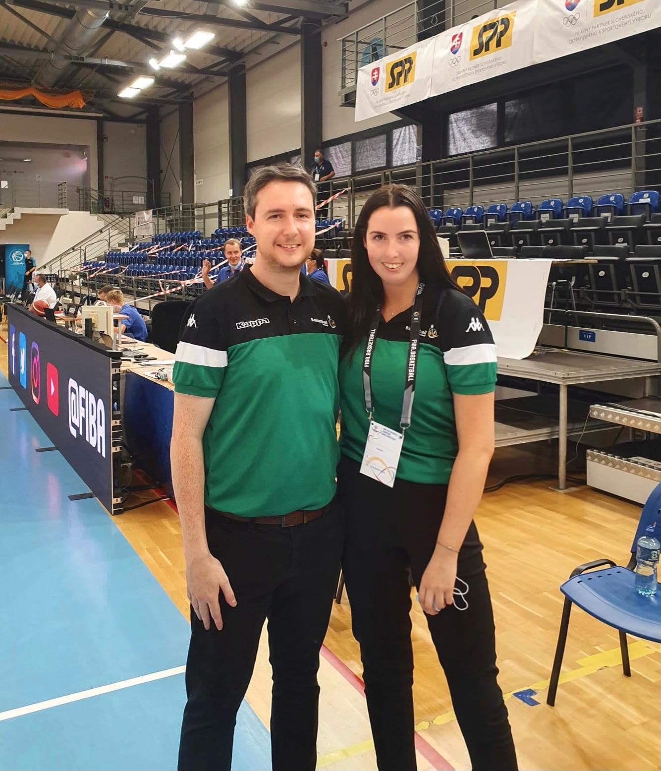 The couple at an international officials' table in Basketball Ireland kit